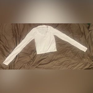 White long sleeve made of stretchy material that is very smooth on the skin
